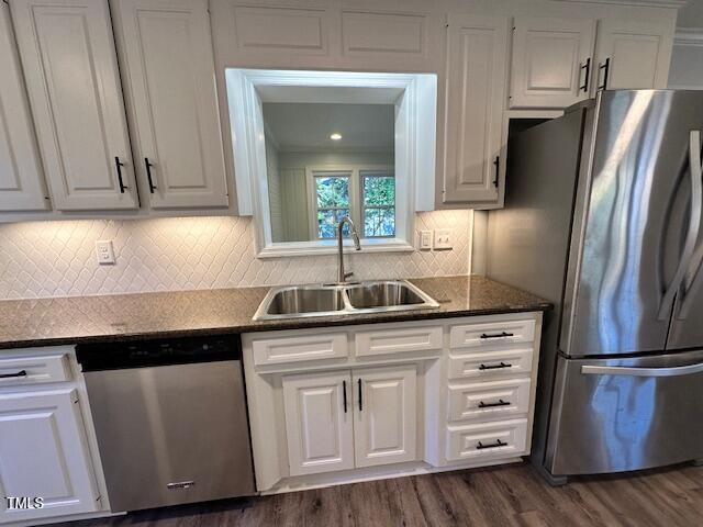 445 N Dunn St, Angier, NC 27501 - kitchen featuring appliances with stainless steel finishes, a sink, white cabinets, and dark wood-style floors