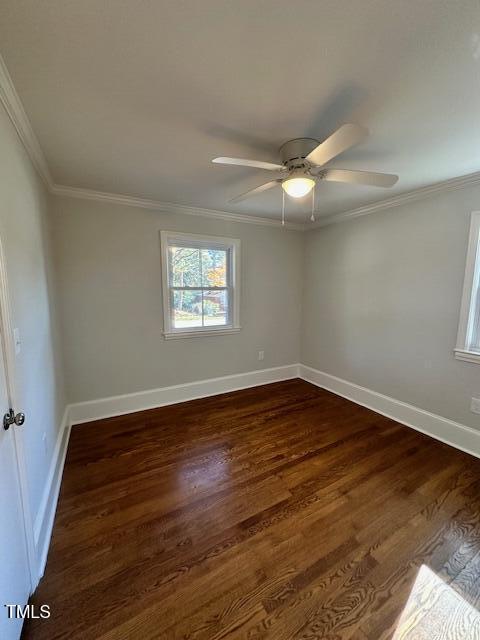 445 N Dunn St, Angier, NC 27501 - empty room featuring ornamental molding, dark wood-style flooring, baseboards, and ceiling fan