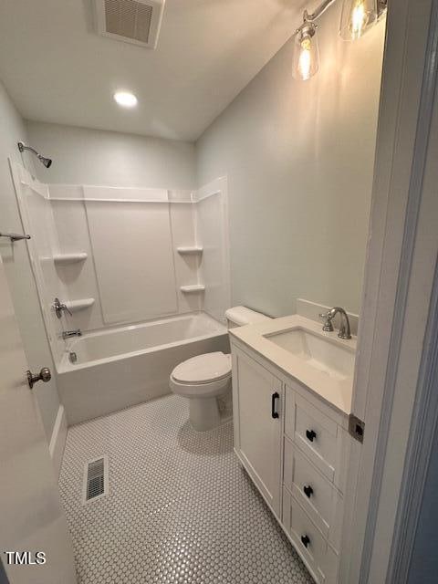 full bathroom featuring tile patterned floors, toilet, vanity, and washtub / shower combination