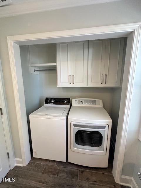 445 N Dunn St, Angier, NC 27501 - laundry area with cabinet space, washer and clothes dryer, and dark wood finished floors