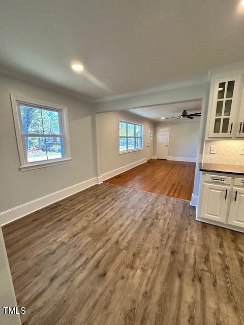 445 N Dunn St, Angier, NC 27501 - unfurnished living room featuring ornamental molding, dark wood-style floors, baseboards, ceiling fan, and recessed lighting