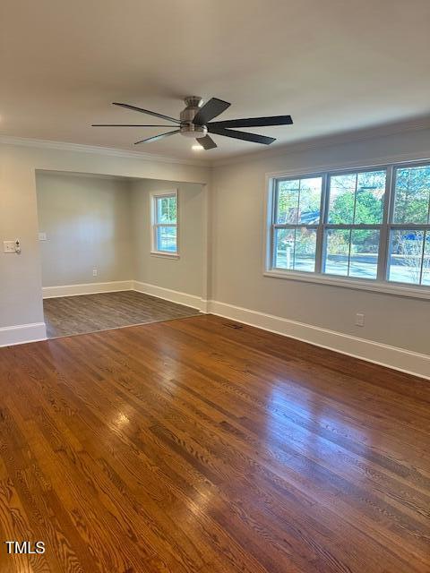 445 N Dunn St, Angier, NC 27501 - empty room with ornamental molding, dark wood-type flooring, baseboards, and a ceiling fan