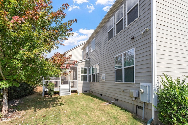 exterior space with a yard and a wooden deck