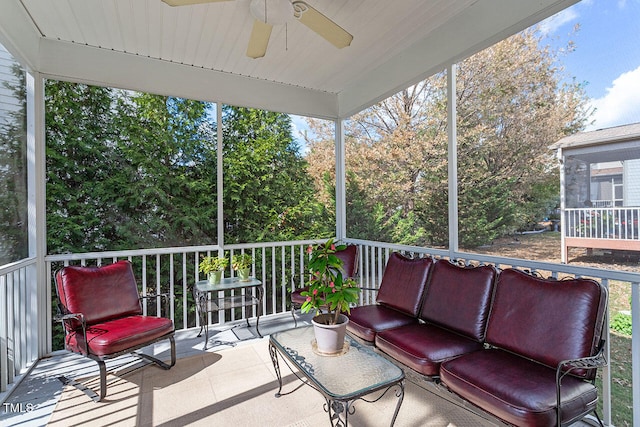 sunroom / solarium with ceiling fan and a healthy amount of sunlight