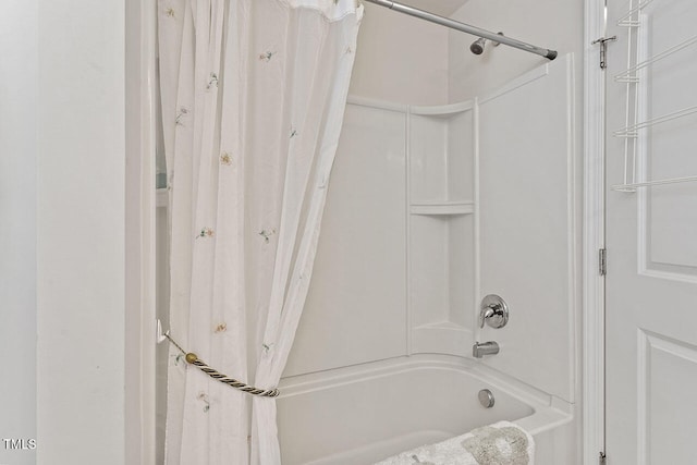 bathroom with shower / tub combo with curtain