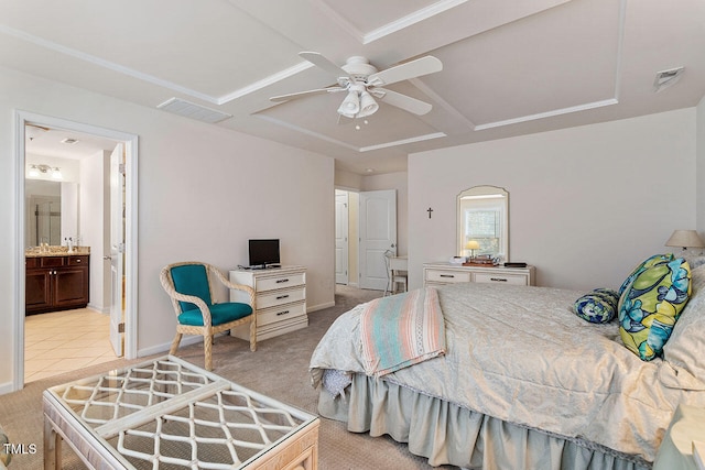 bedroom featuring ceiling fan, light colored carpet, and ensuite bathroom