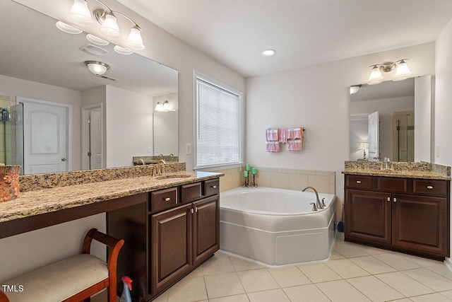 bathroom with tile patterned flooring, vanity, and shower with separate bathtub