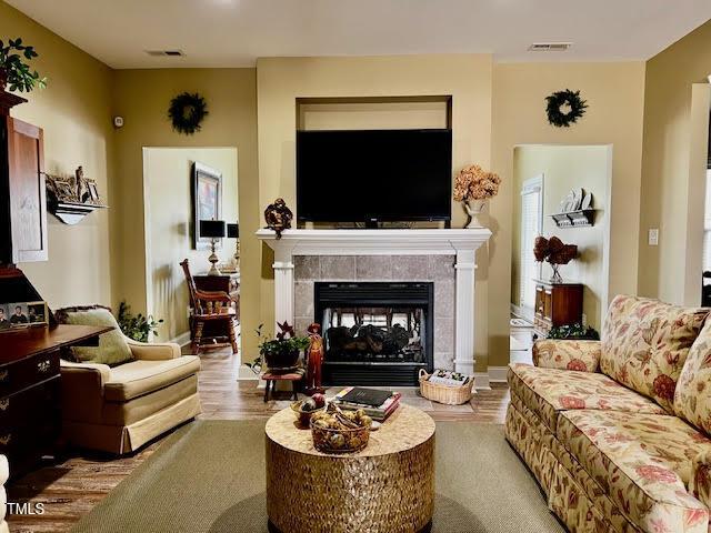 living room featuring a fireplace