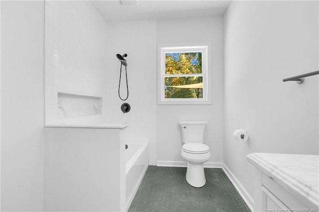 bathroom featuring tiled shower / bath combo and toilet