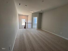 spare room featuring carpet flooring