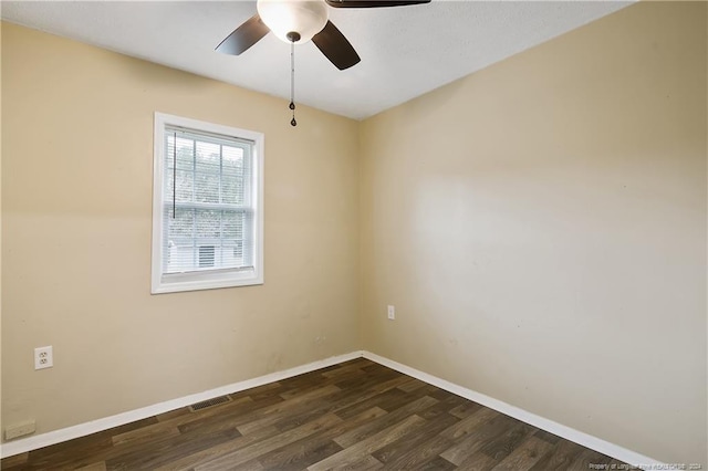 unfurnished room with ceiling fan and dark hardwood / wood-style flooring