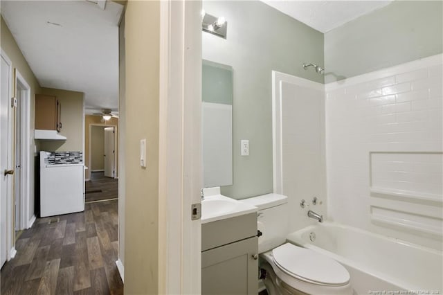 full bathroom with ceiling fan, bathing tub / shower combination, wood-type flooring, toilet, and vanity