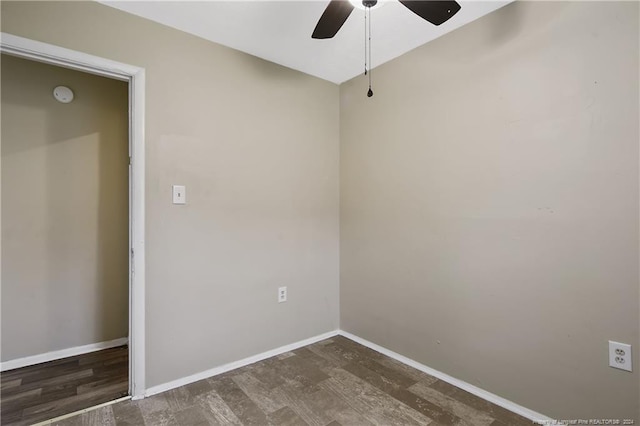 unfurnished room featuring dark hardwood / wood-style floors and ceiling fan