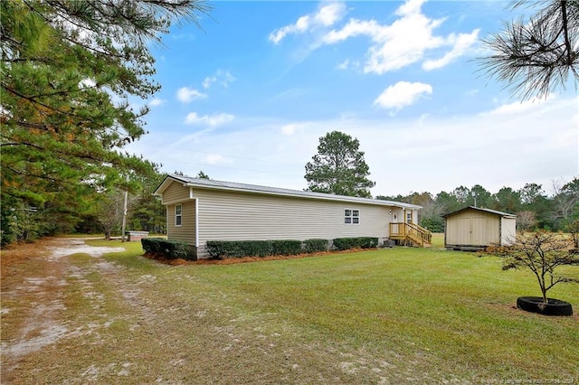 exterior space featuring a storage unit and a yard