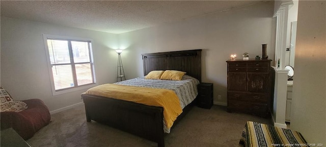 carpeted bedroom with a textured ceiling