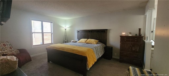 carpeted bedroom featuring a textured ceiling