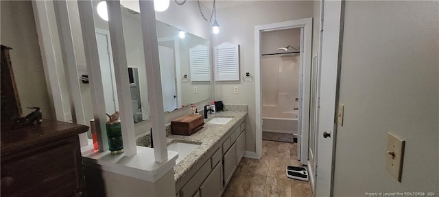 bathroom with vanity and  shower combination