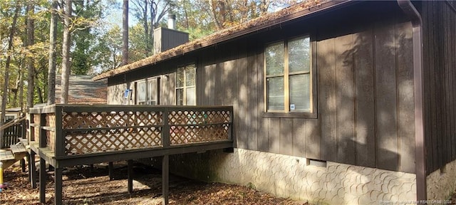 view of side of property featuring a deck