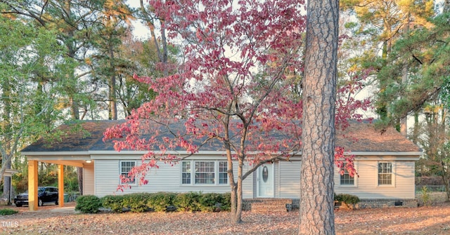 view of front of home featuring a carport