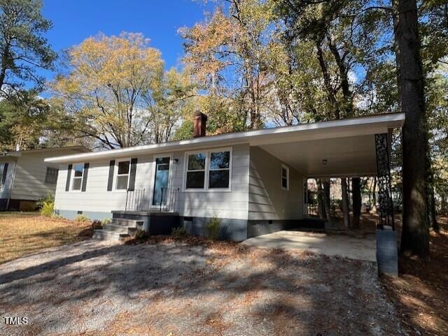 view of front facade with a carport