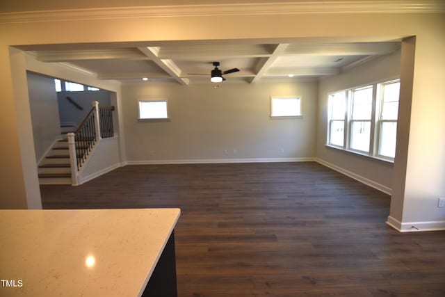 unfurnished room with ceiling fan, dark wood-type flooring, coffered ceiling, baseboards, and stairs