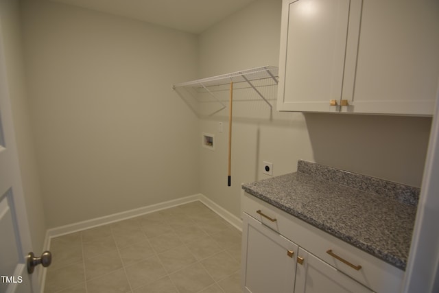 laundry room with washer hookup, cabinet space, electric dryer hookup, and baseboards