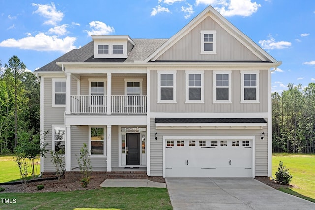 35 Accord Dr, Youngsville, NC 27596 - view of front of property featuring a balcony, driveway, an attached garage, covered porch, and a front lawn
