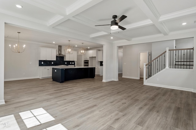 35 Accord Dr, Youngsville, NC 27596 - kitchen featuring open floor plan, wall chimney exhaust hood, coffered ceiling, a chandelier, and beamed ceiling