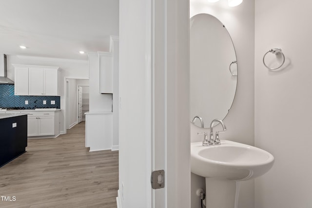 35 Accord Dr, Youngsville, NC 27596 - bathroom featuring backsplash, wood finished floors, a sink, and recessed lighting