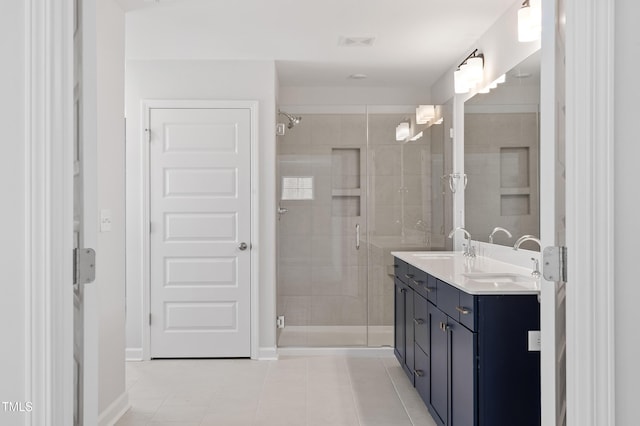 35 Accord Dr, Youngsville, NC 27596 - bathroom with a shower stall, double vanity, tile patterned flooring, and baseboards