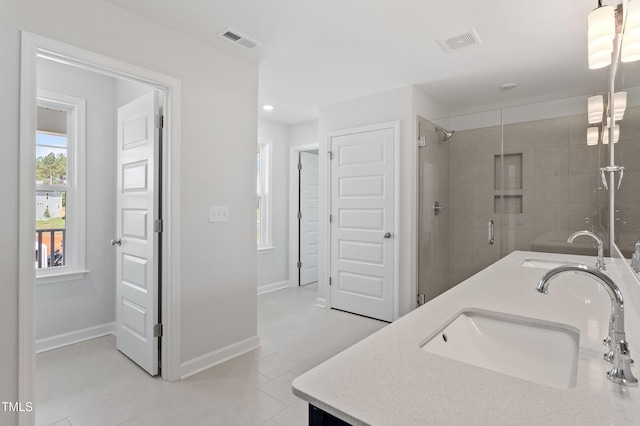 35 Accord Dr, Youngsville, NC 27596 - full bathroom with double vanity, tile patterned floors, baseboards, tiled shower, and recessed lighting