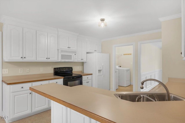 kitchen featuring white appliances, sink, ornamental molding, light tile patterned flooring, and white cabinetry