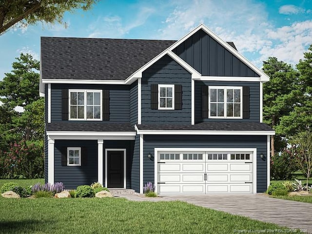 view of front of house featuring a garage and a front yard