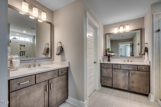 bathroom with tile patterned floors and vanity