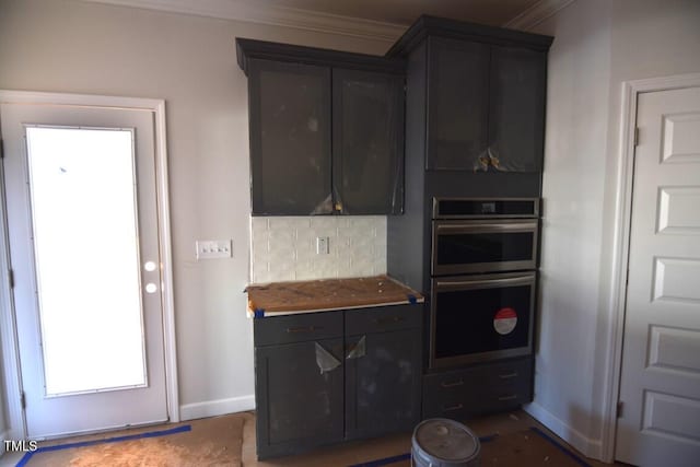 kitchen with double oven, ornamental molding, and decorative backsplash