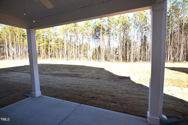 view of patio with a view of trees