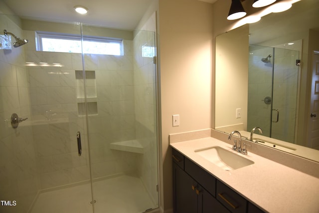 full bath featuring a stall shower and vanity