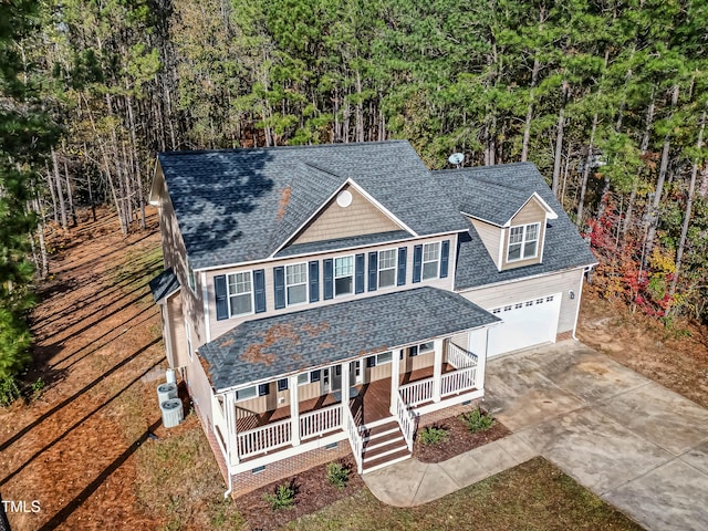 view of front facade featuring a porch and a garage