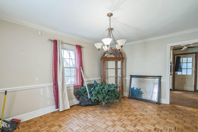 unfurnished dining area with ceiling fan with notable chandelier, ornamental molding, and light parquet floors