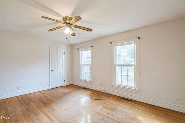 unfurnished room featuring ceiling fan and light wood-type flooring