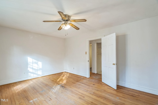 unfurnished room with ceiling fan and light hardwood / wood-style flooring