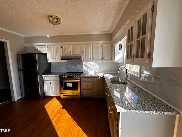 kitchen featuring sink, dark hardwood / wood-style floors, light stone countertops, ornamental molding, and stainless steel appliances