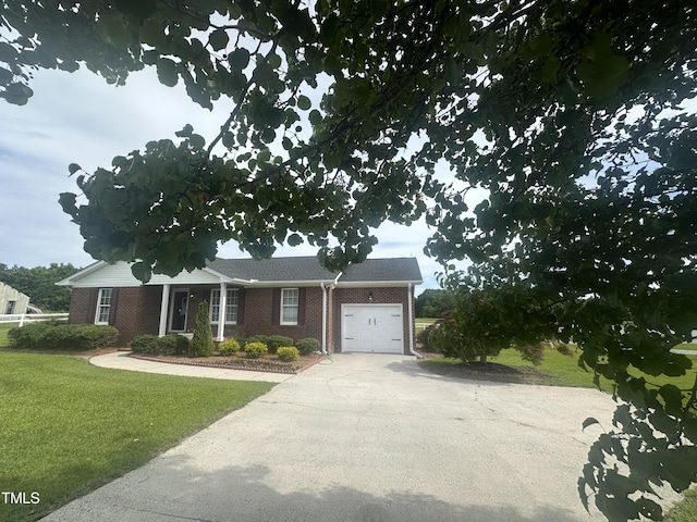 5148 Benson Rd, Angier, NC 27501 - view of front of property featuring an attached garage, brick siding, a front lawn, and concrete driveway