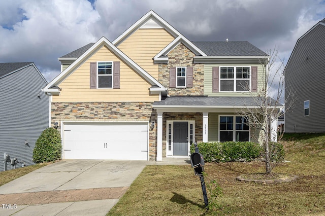 craftsman inspired home featuring a front lawn and a garage