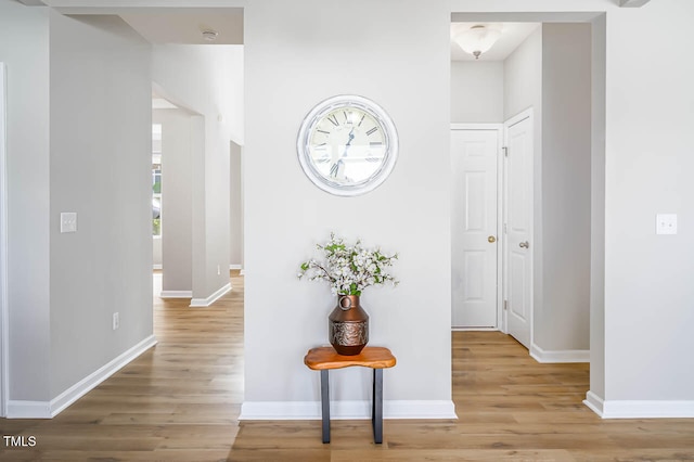 hallway with light wood-type flooring