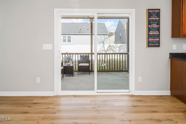 doorway to outside featuring light hardwood / wood-style flooring