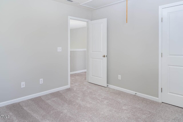 empty room with light colored carpet