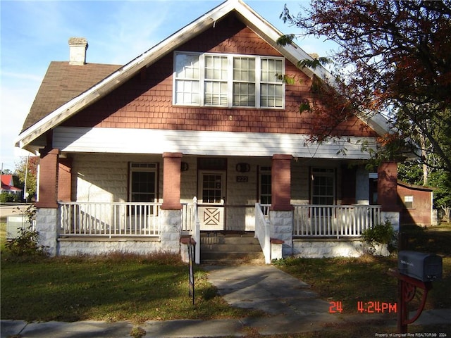 view of front of property featuring covered porch