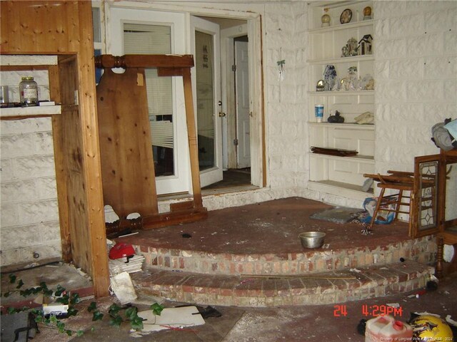 miscellaneous room featuring built in shelves