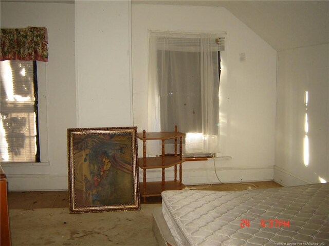 bedroom featuring lofted ceiling